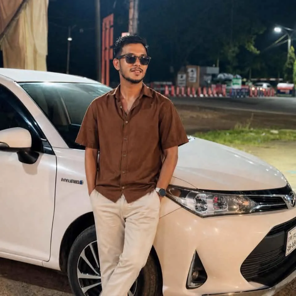 Kashim Uddin Masum at night by a car